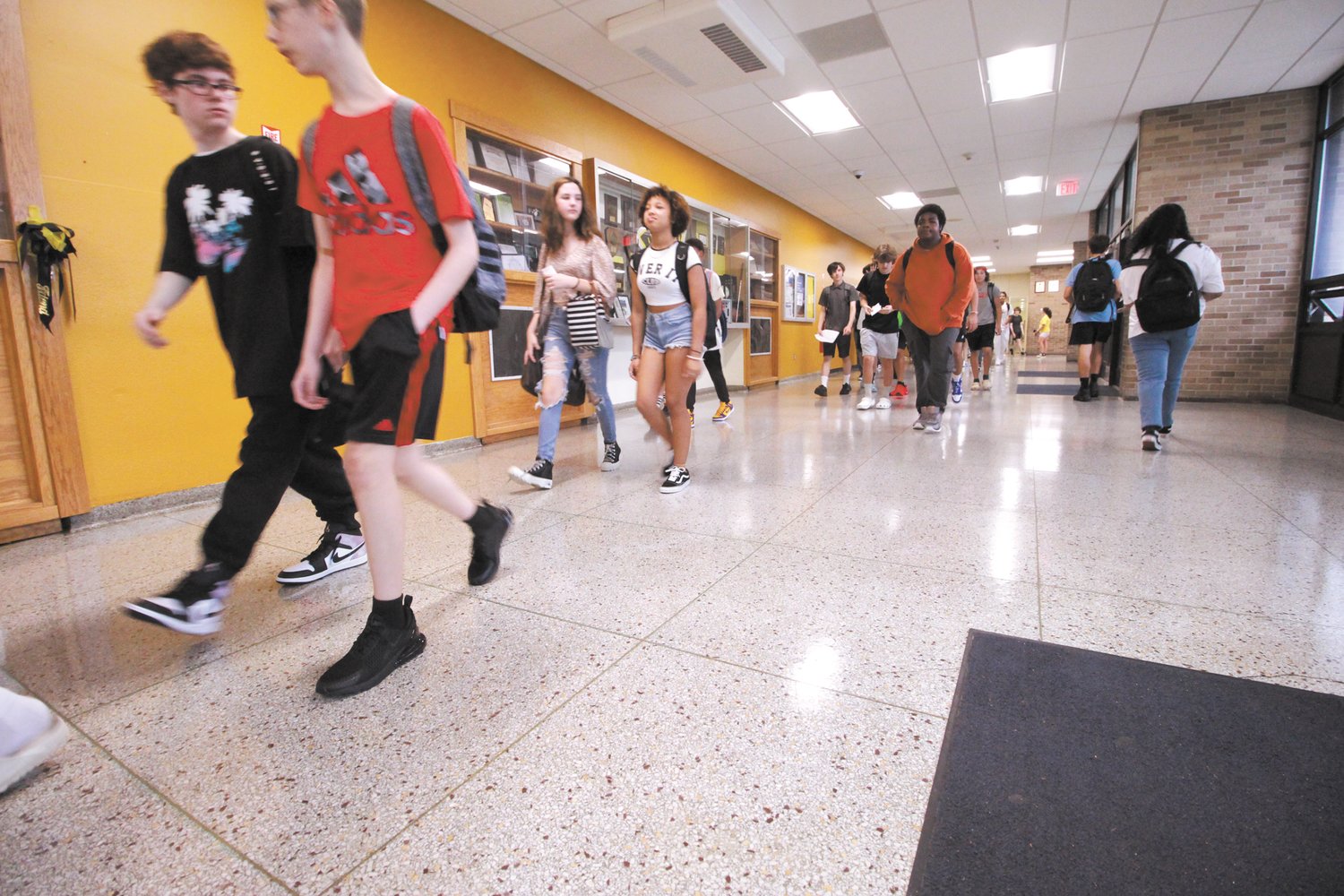 CORRIDORS ARE BUSY: Pilgrim freshmen navigate corridors on their way to their classrooms yesterday.
